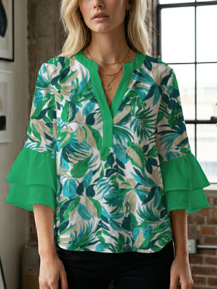 Damen Bluse mit voluminösen Rüschenärmeln und modernem Motiv Echo Archiv