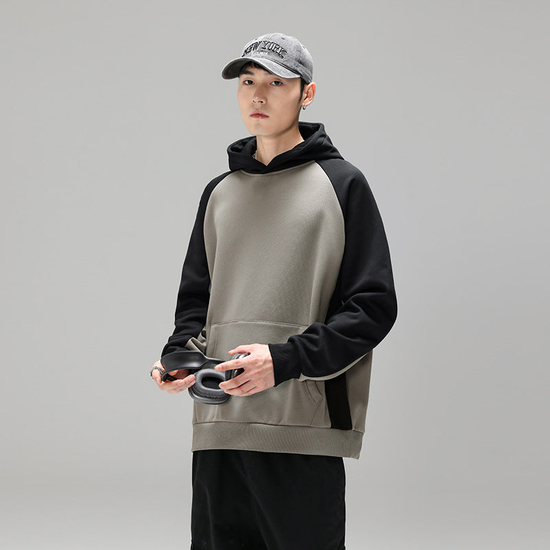 Herren Kapuzenpullover im Colourblock-Design mit Raglanärmeln, Kängurutasche und geripptem Saum Echo Archiv