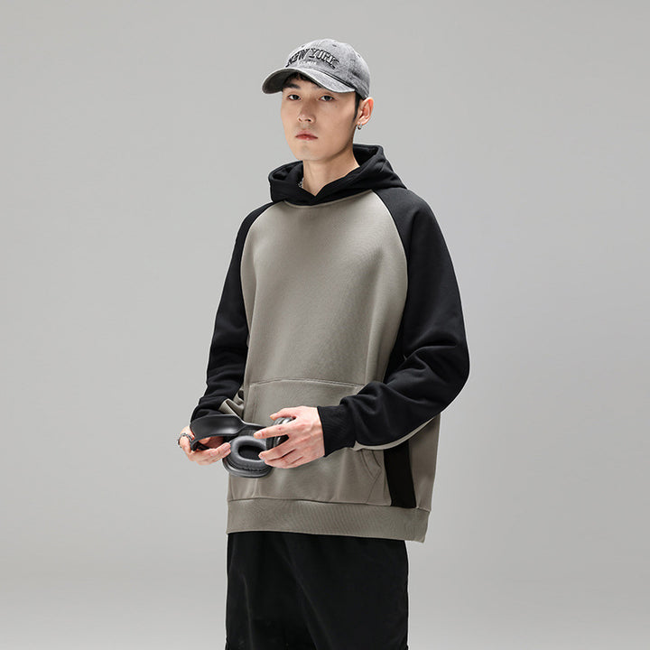 Herren Kapuzenpullover im Colourblock-Design mit Raglanärmeln, Kängurutasche und geripptem Saum Echo Archiv