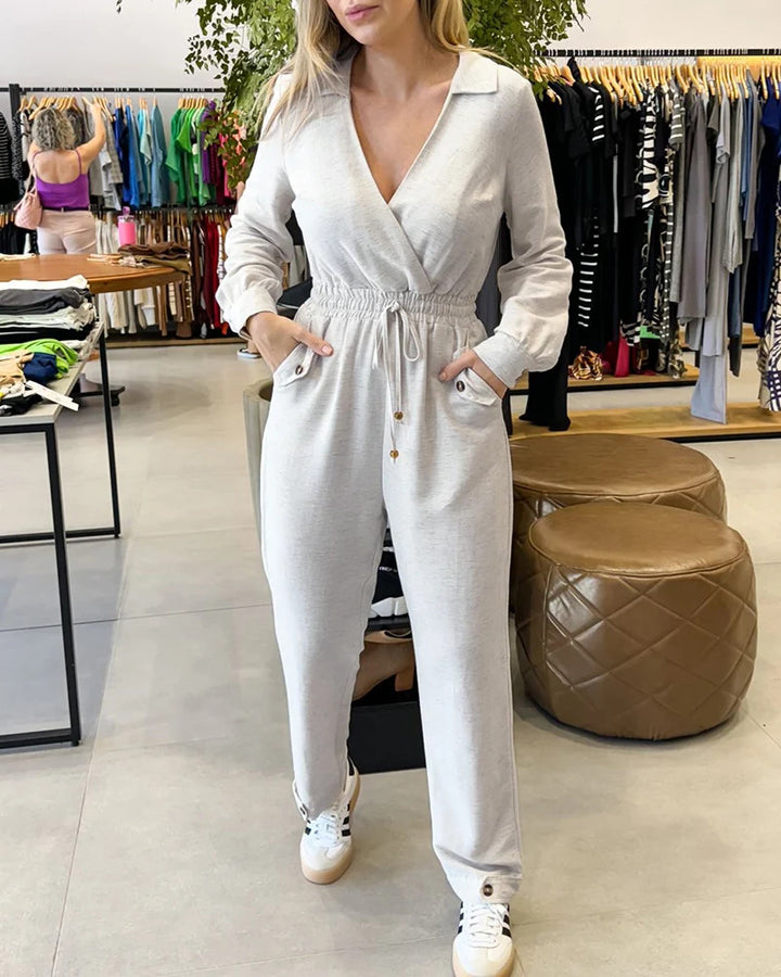 Damen Stilvoller Jumpsuit mit Wickeldesign und Taillengürtel Echo Archiv