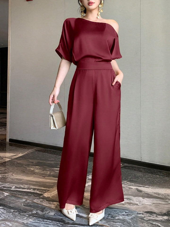 Damen Ein Schulter Jumpsuit mit weitem Bein und elegantem Schnitt Echo Archiv