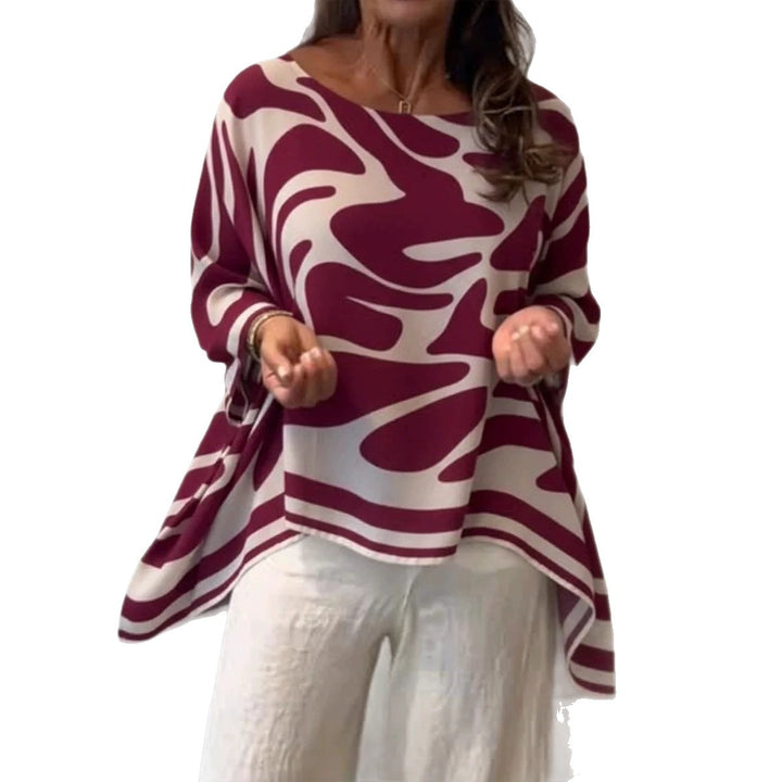 Damen Oversize Sommerbluse mit abstraktem Print, Fledermausärmeln und asymmetrischem Saum – Élovi