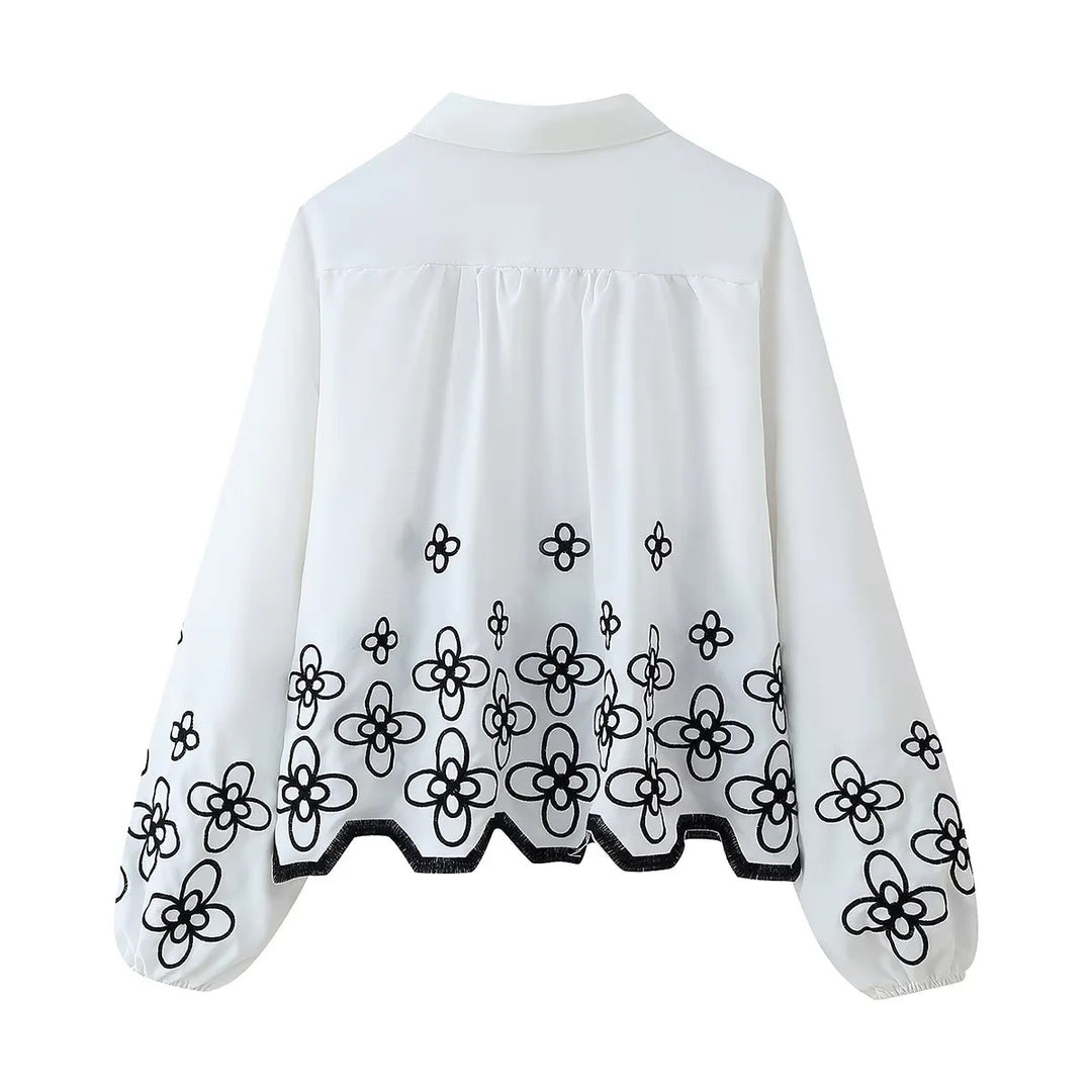 Damen bestickte Chiffon-Bluse mit floralem Saum, Volumenärmeln und Hemdkragen – Élovi