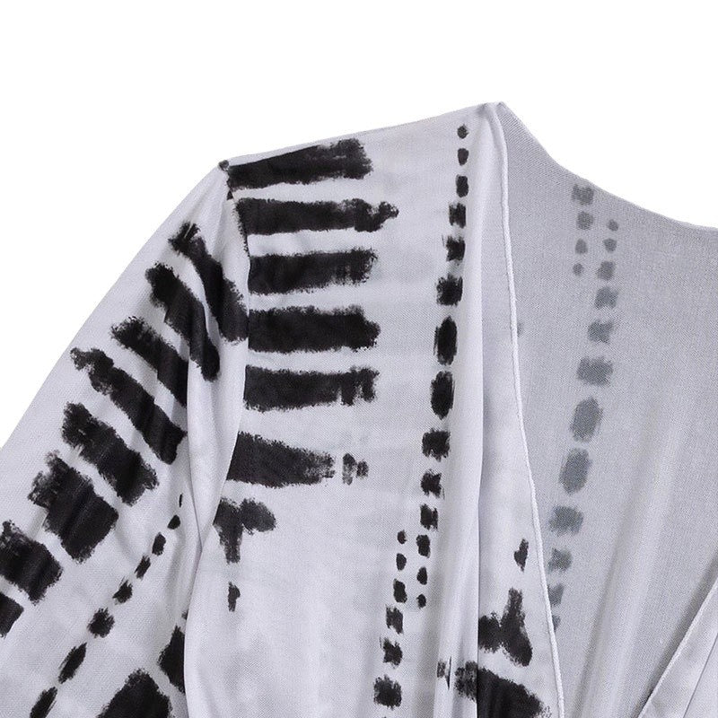 Damen Strandkleid mit tiefem V-Ausschnitt und verstellbaren Rüschendetails Echo Archiv