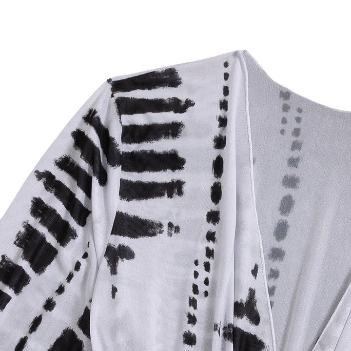 Damen Strandkleid mit tiefem V-Ausschnitt und verstellbaren Rüschendetails Echo Archiv