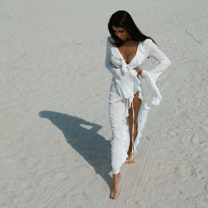 Damen Elegantes Strandkleid mit Rüschendetails und tiefem V-Ausschnitt Echo Archiv