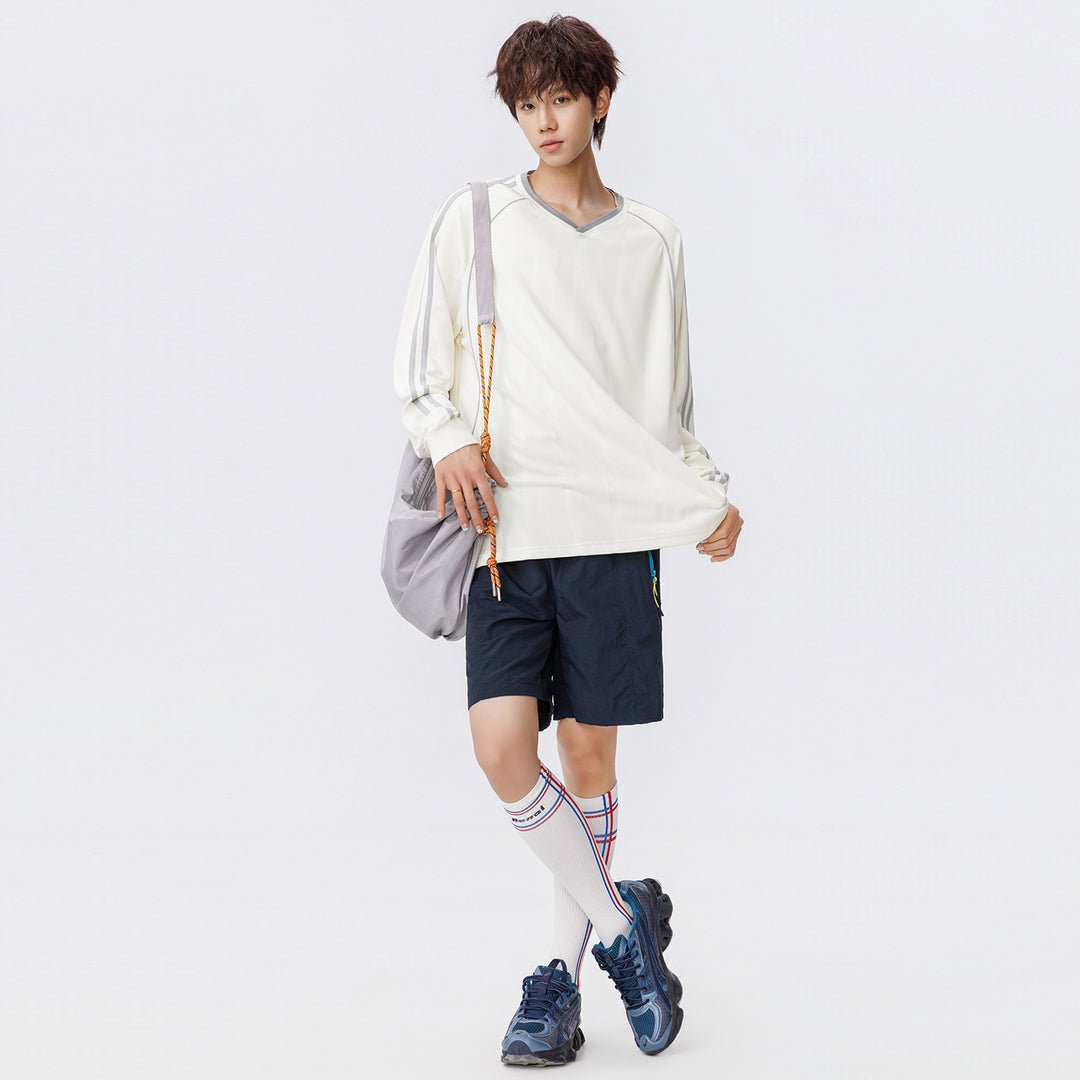 Damen Weites V-Ausschnitt Oversize-Sportshirt mit Raglanärmeln und Kontraststreifen Echo Archiv