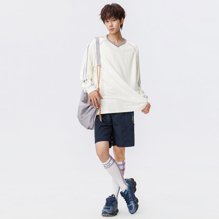 Damen Weites V-Ausschnitt Oversize-Sportshirt mit Raglanärmeln und Kontraststreifen Echo Archiv