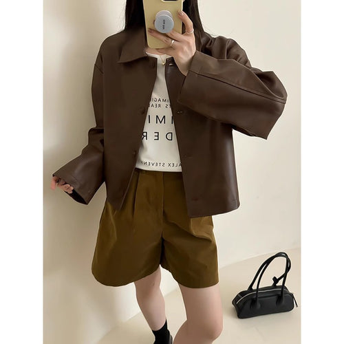 Damen Boxy‑Kunstleder‑Hemdjacke mit verdeckter Knopfleiste und überschnittenen Schultern Echoarchiv