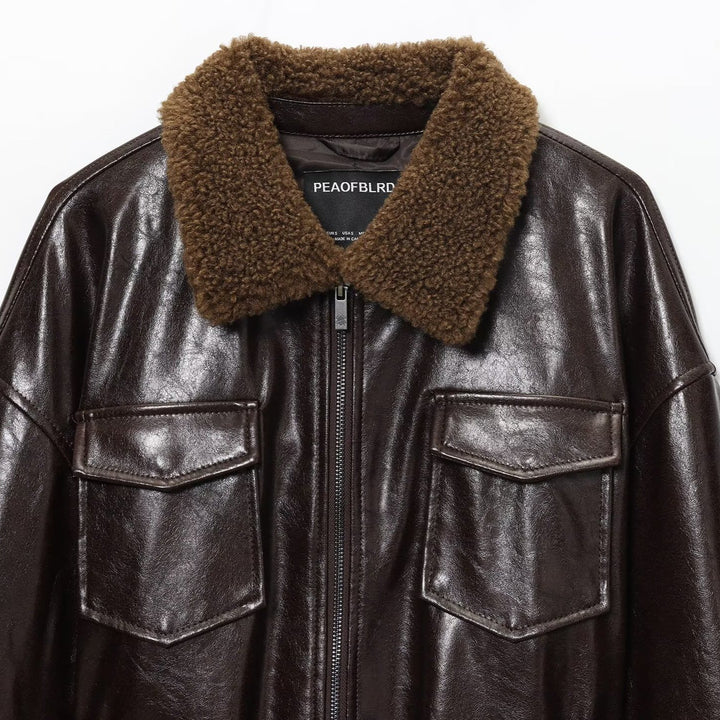 Damen Oversized Lederimitat-Jacke mit Teddykragen und Taillengürtel Echoarchiv