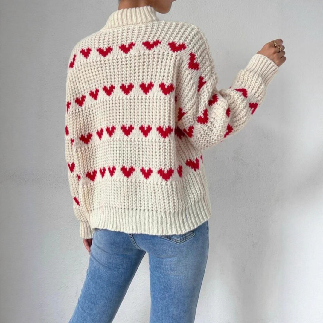 Damen nan Grobstrickpullover mit eingestrickten Herzmotiven, hohem Stehkragen und lässiger Oversize-Silhouette Echo Archiv