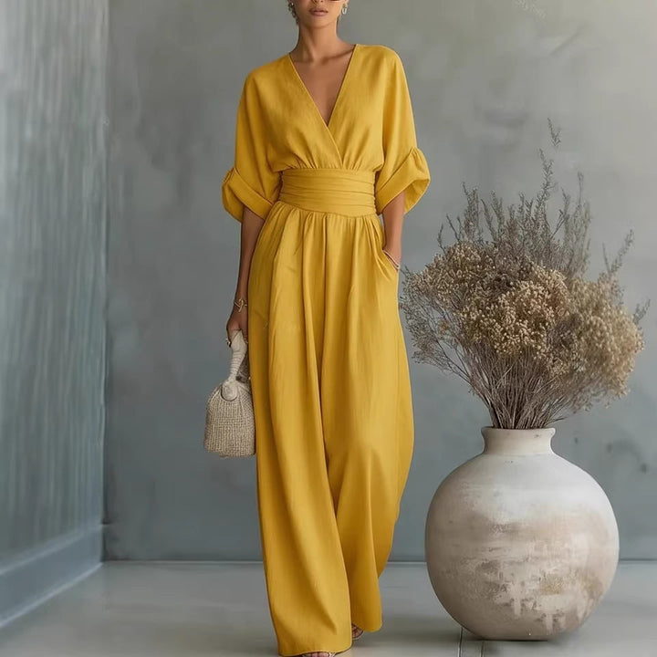 Echoarchiv | Eleganter Ärmelloser Jumpsuit mit Tiefem V-Ausschnitt, Taillenbund und Weitem Bein