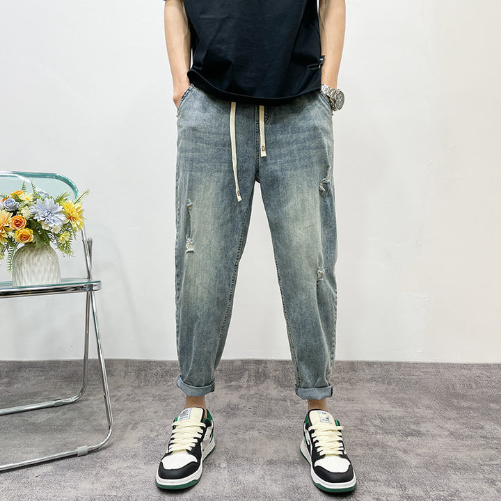 Herren lockere Jeanshose mit Distressed-Optik Echoarchiv