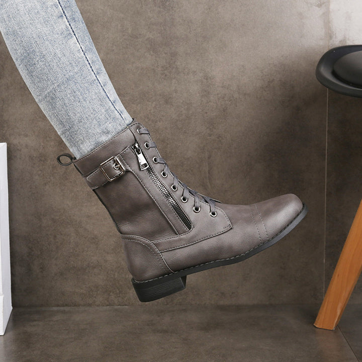 Damen nan knöchelhohe Vintage-Lederoptik Combat-Stiefelette mit seitlichem Reißverschluss, dekorativem Schnallenriemen und leichtem Blockabsatz Echo Archiv