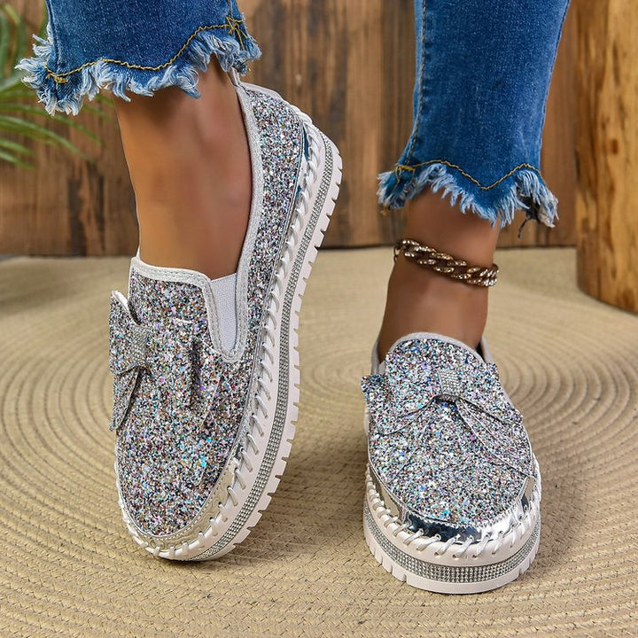 Damen Glitzer-Plateau-Slipper mit Schleifenapplikation und profilierter Komfortsohle Echo Archiv