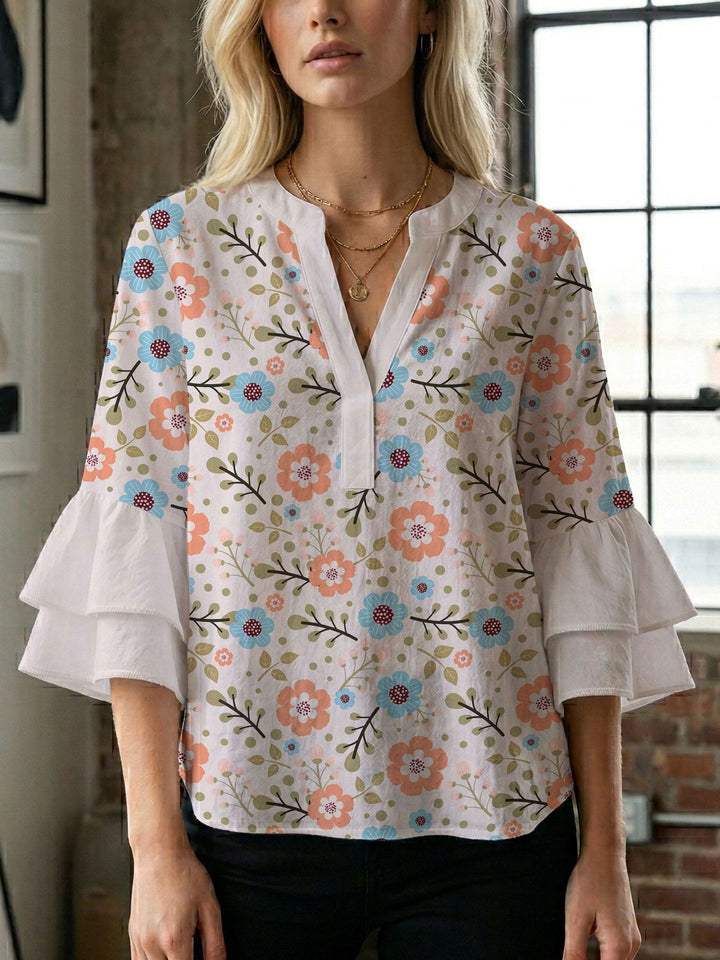 Damen Bluse mit voluminösen Flügelärmel und intensivem Blattmuster Echo Archiv