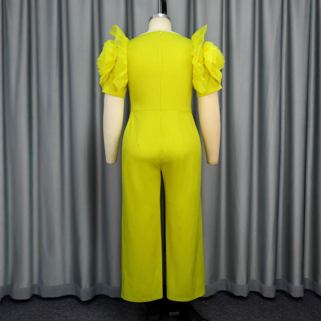 Damen eleganter Jumpsuit mit voluminösen Puffärmeln und Perlenakzent Echo Archiv