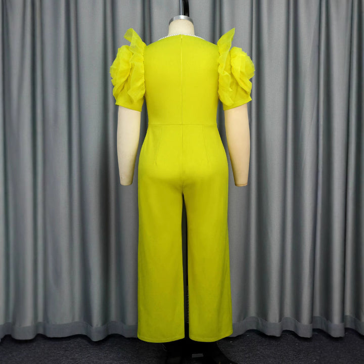 Damen eleganter Jumpsuit mit voluminösen Puffärmeln und Perlenakzent Echo Archiv