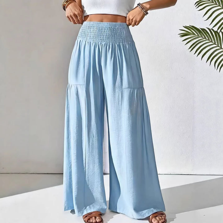 Damen weite Palazzo-Hose mit gerafftem Smock-Bund und Stufendetails – Avélisse