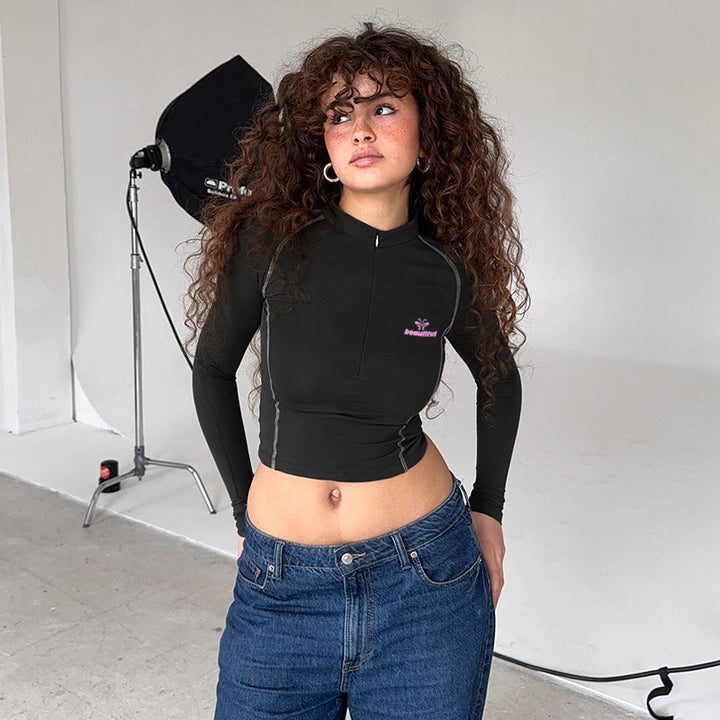 Damen Sportliches tailliertes Langarm-Performance-Shirt mit kurzem Frontreißverschluss – Avérine
