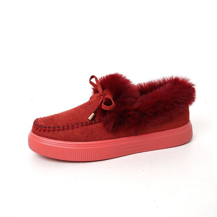 Damen Kuschel‑Mokassin‑Slipper mit hochfloriger Fellmanschette, dekorativer Steppnaht und leichtem Plateau‑Sohlenprofil Echo Archiv