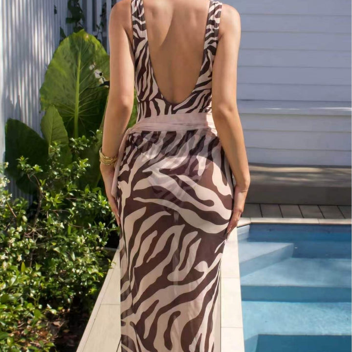 Damen Eleganter Strandmode-Anzug mit tiefem V-Ausschnitt und Gürtel Echo Archiv