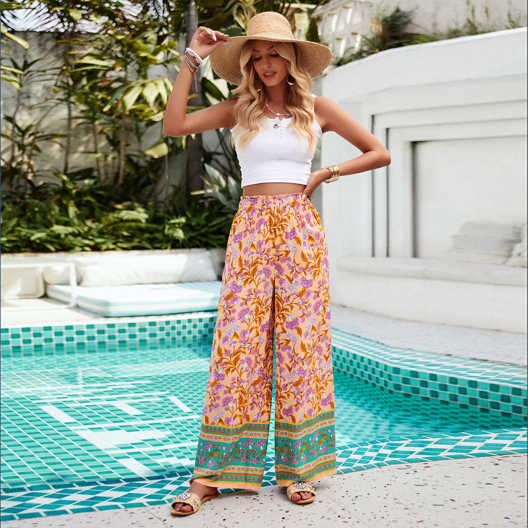 Damen weite Palazzohose mit gerafftem Bund, seitlichen Eingrifftaschen und floraler Boho-Print – Avélisse