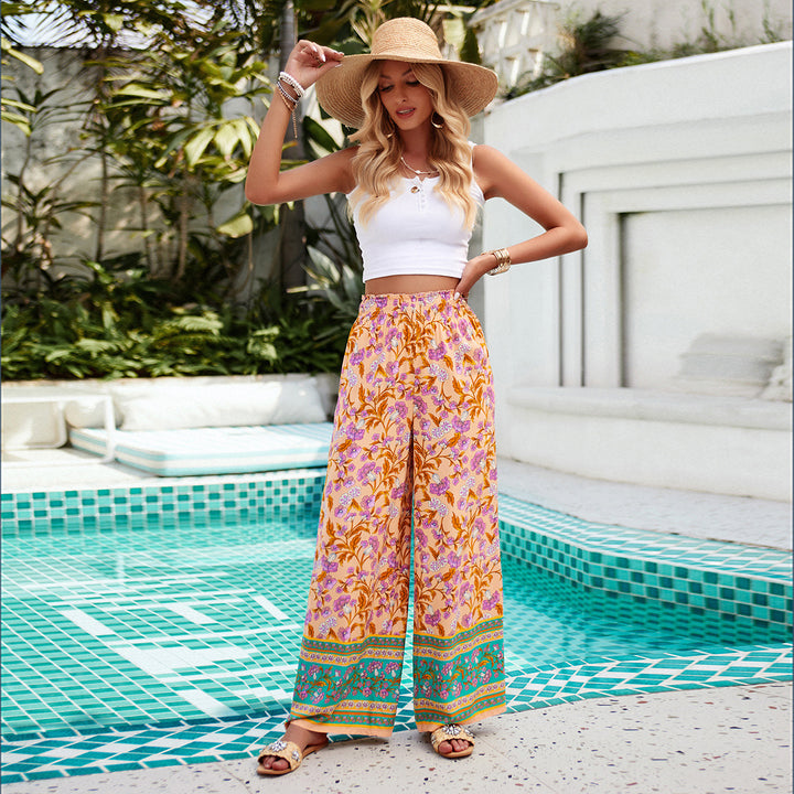 Damen weite Palazzohose mit gerafftem Bund, seitlichen Eingrifftaschen und floraler Boho-Print – Avélisse