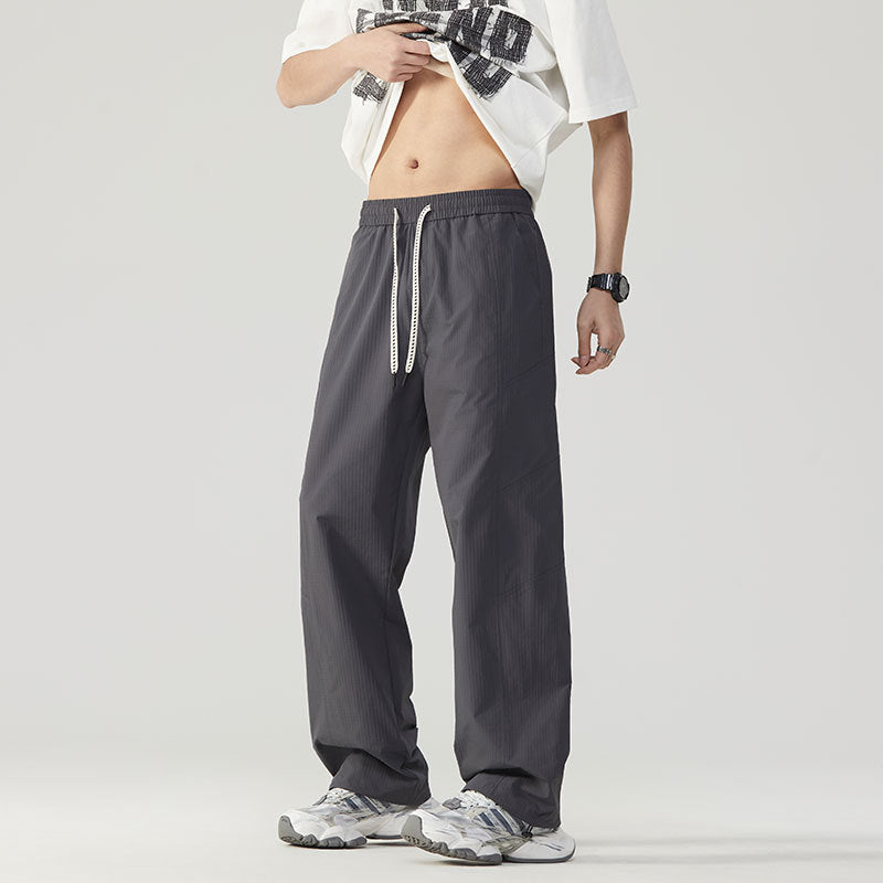 Herren Atmungsaktive Sporthose mit verstellbarem Bund und seitlichen Reißverschlusstaschen Echoarchiv