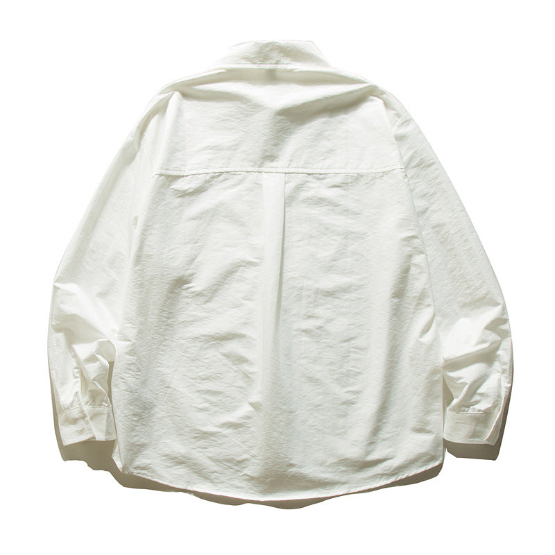 Unisex Oversize Baumwollhemd mit kastigem Schnitt, Brusttasche und abgerundetem Saum Echoarchiv