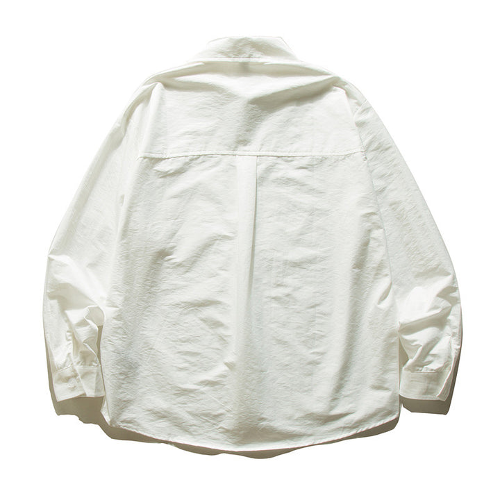 Unisex Oversize Baumwollhemd mit kastigem Schnitt, Brusttasche und abgerundetem Saum Echoarchiv