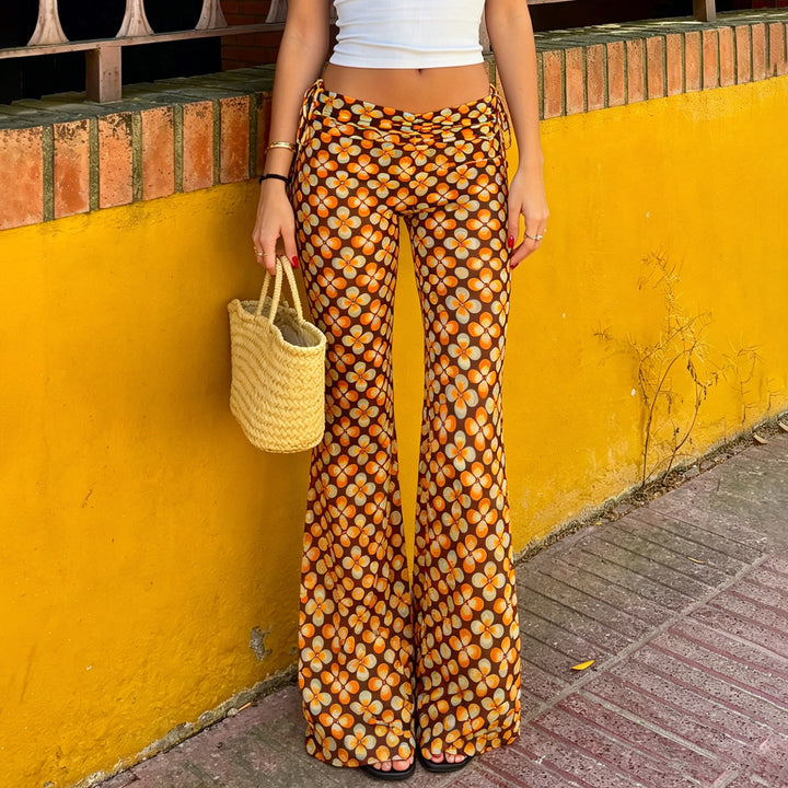 Damen nan ausgestellte Schlaghose mit hoher Taille, seitlichen Kordelzügen und retro Blumenprint Echo Archiv