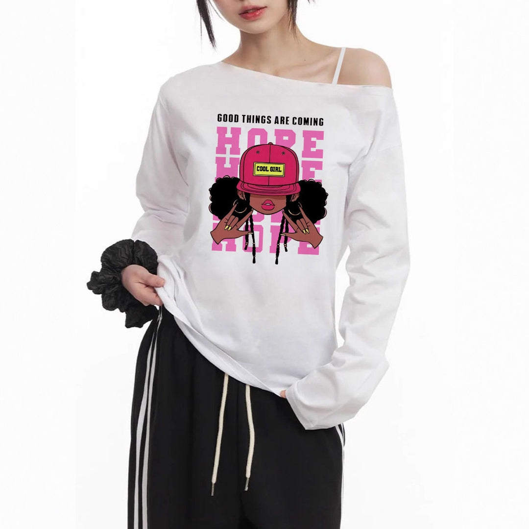 Damen lässiges Off-Shoulder Langarmshirt mit großflächigem Cartoon-Grafikprint und elastischem Baumwollmix – Avérine