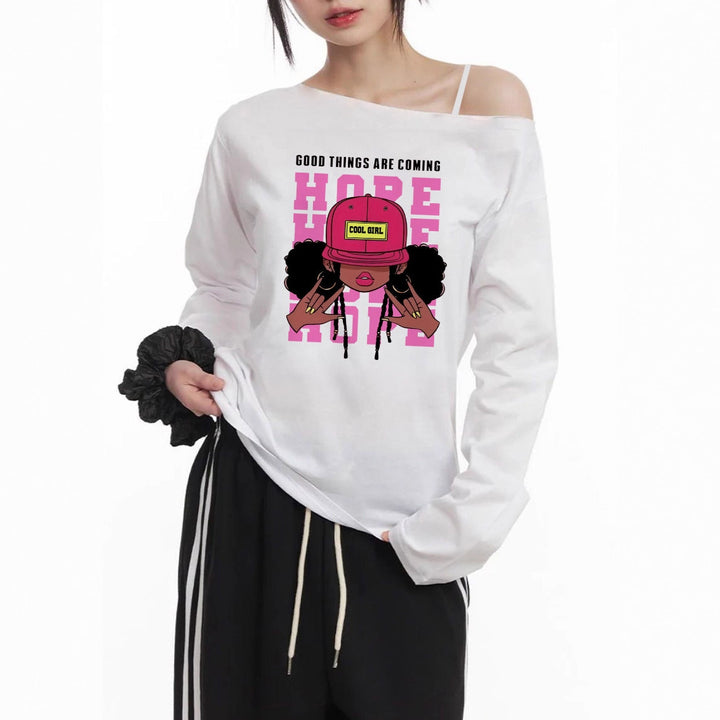 Damen lässiges Off-Shoulder Langarmshirt mit großflächigem Cartoon-Grafikprint und elastischem Baumwollmix – Avérine