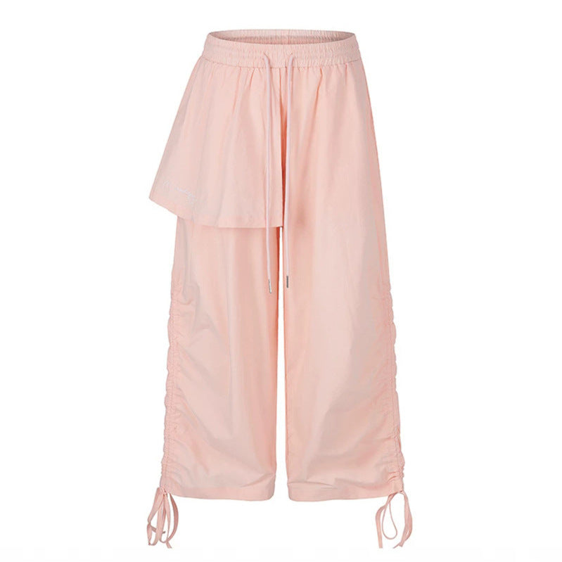 Damen Weite Capri-Hose mit Tunnelzug, seitlicher Raffung und asymmetrischer Überlagerung Echoarchiv