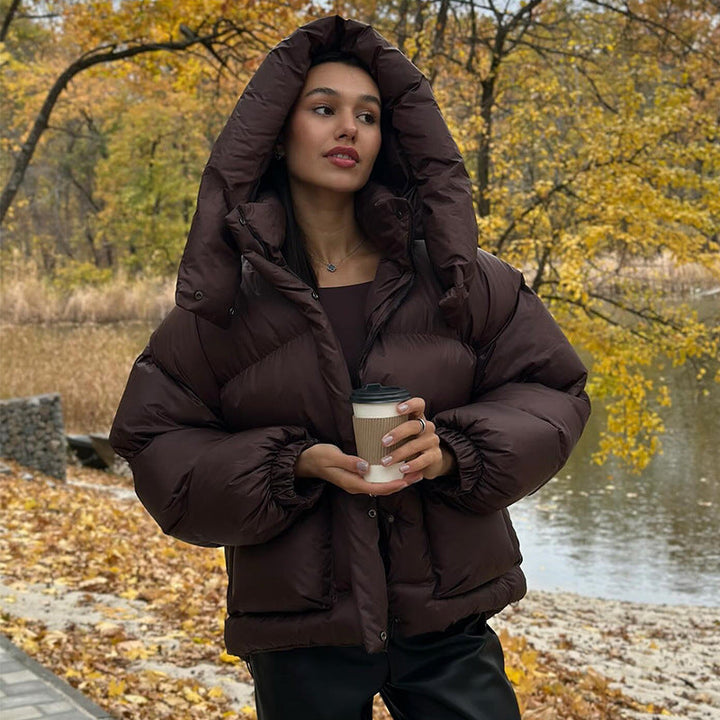 Echoarchiv | Damen Gesteppte Winterjacke mit Oversized Kapuze – Warm, Wasserabweisend & Modern
