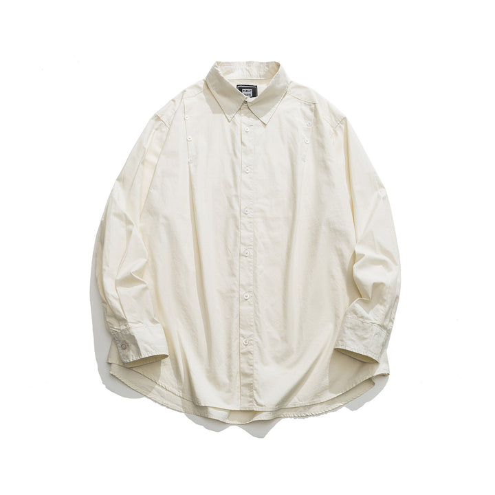 Unisex Oversized Hemdjacke mit seitlichen Zierknopfreihen und gerundetem Saum Echoarchiv