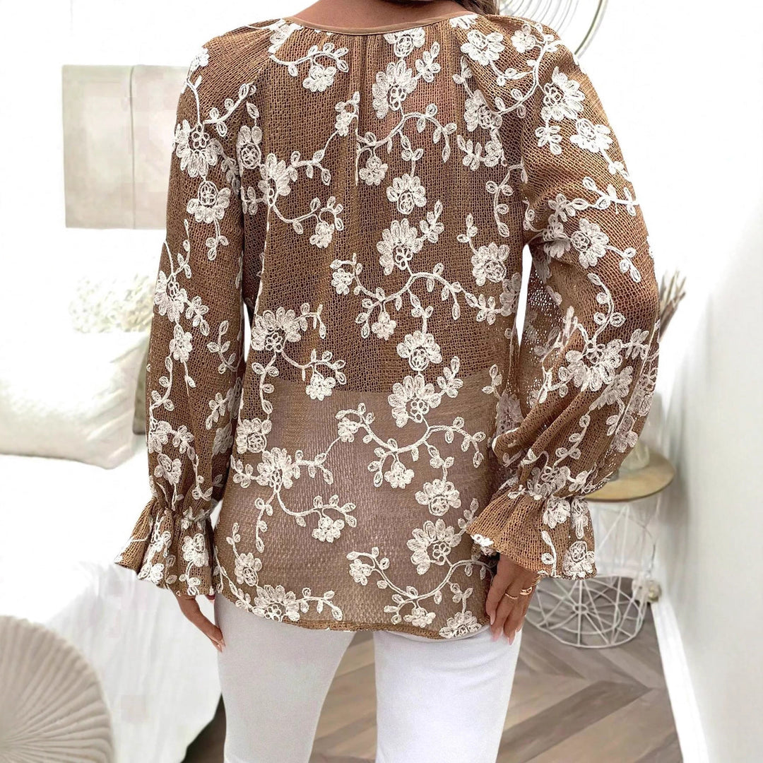 Damen V‑Neck Bluse mit floraler Stickerei, Perlenknopfleiste und Ballonärmeln – Avérine