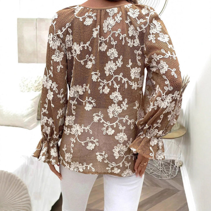 Damen V‑Neck Bluse mit floraler Stickerei, Perlenknopfleiste und Ballonärmeln – Avérine