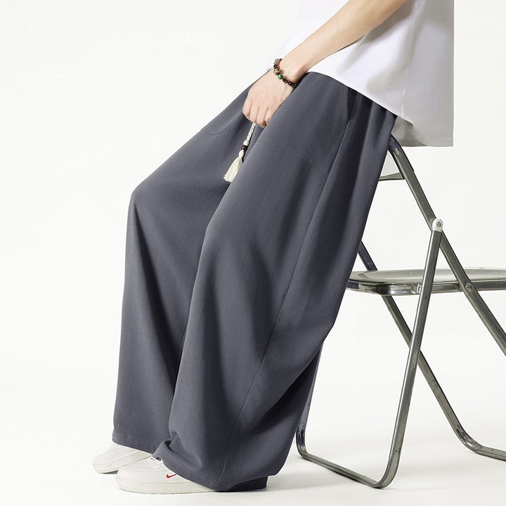 Herren Weit geschnittene Lounge-Hose mit Quasten-Kordel, elastischem Bund und aufgesetzten Taschen Echo Archiv