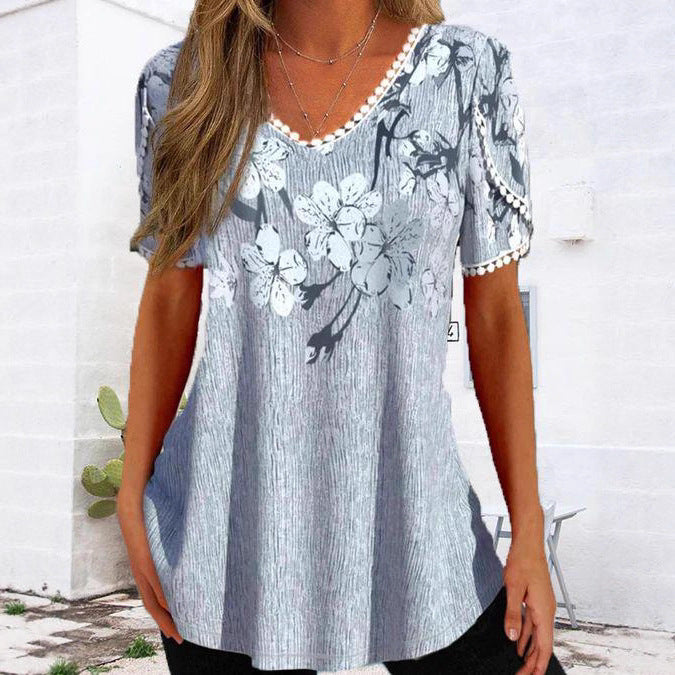 Damen nan legeres V-Ausschnitt-Tunikashirt mit floralem Muster und Pomponbesatz Echo Archiv