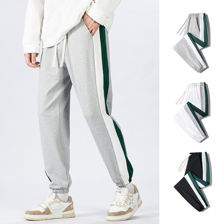 Herren Konische Trackhose mit Kordelzug, seitlichen Colorblock‑Streifen & elastischen Bündchen Echoarchiv
