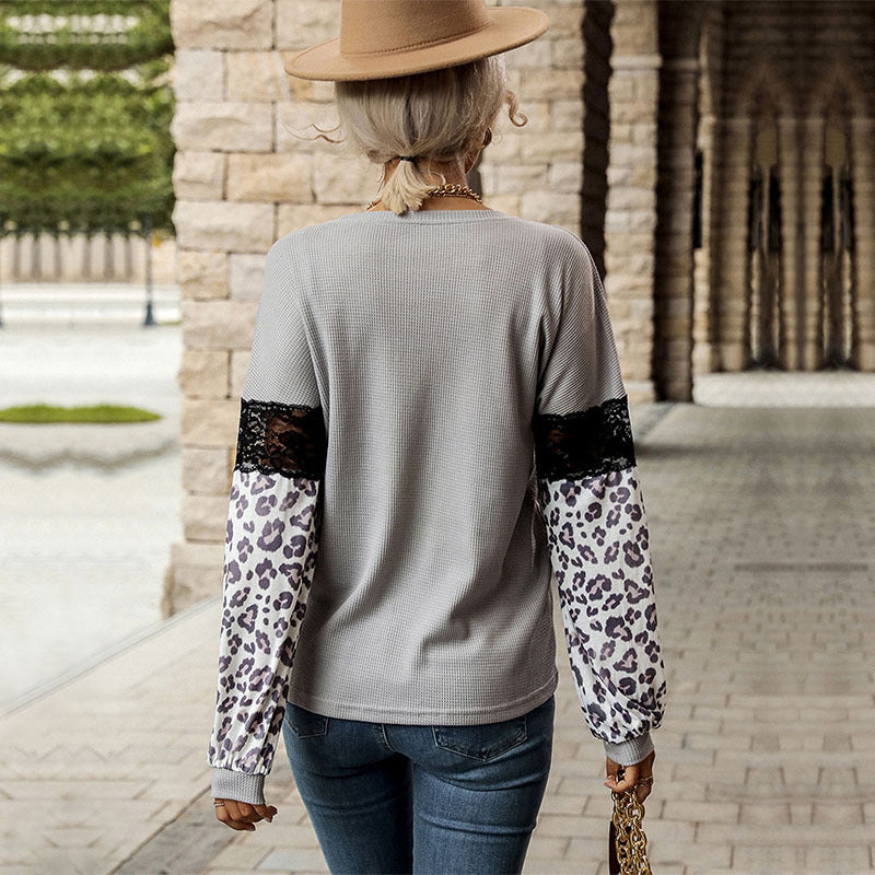 Damen Langarmshirt mit Leopardenärmeln und Spitzenbesatz Echoarchiv