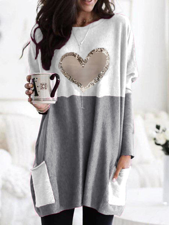 Damen Oversized Lange Pullover Tunika mit Pailletten-Herz und aufgesetzten Taschen Echoarchiv