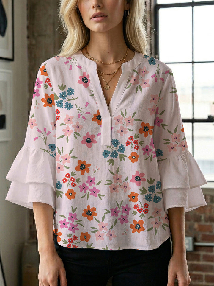 Damen Bluse mit voluminösen Flügelärmel und intensivem Blattmuster Echo Archiv