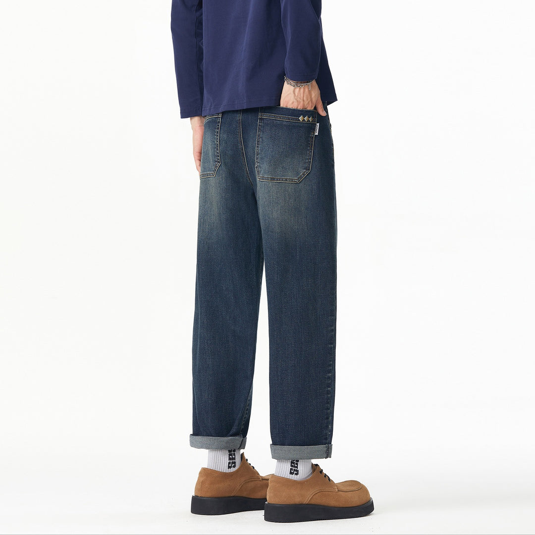 Herren Weite gerade geschnittene Denim-Jeans mit Used‑Wash und Umschlagbund Echoarchiv