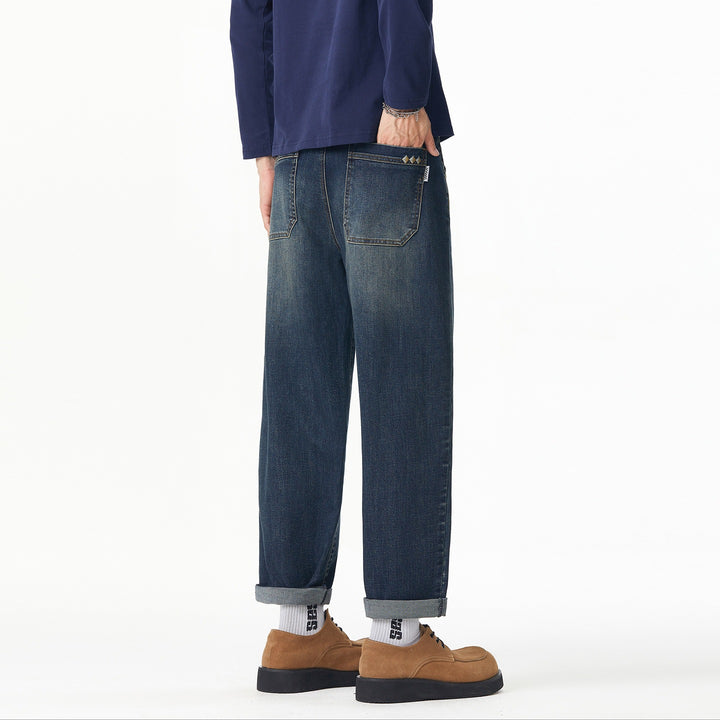 Herren Weite gerade geschnittene Denim-Jeans mit Used‑Wash und Umschlagbund Echoarchiv