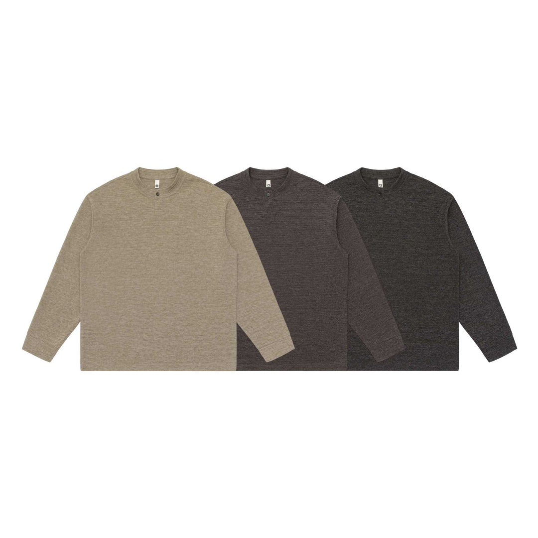 Unisex Strukturierter Henley-Pullover mit kurzem Knopfkragen und Oversize-Schnitt Echoarchiv