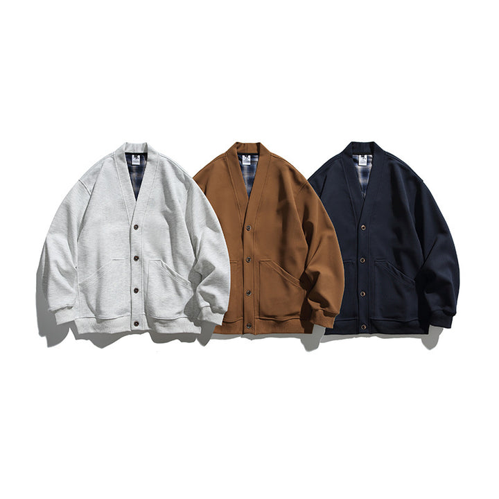 Unisex Boxy-Cardigan-Jacke mit V-Ausschnitt, aufgesetzten Taschen und kariert gefüttertem Innenfutter Echo Archiv