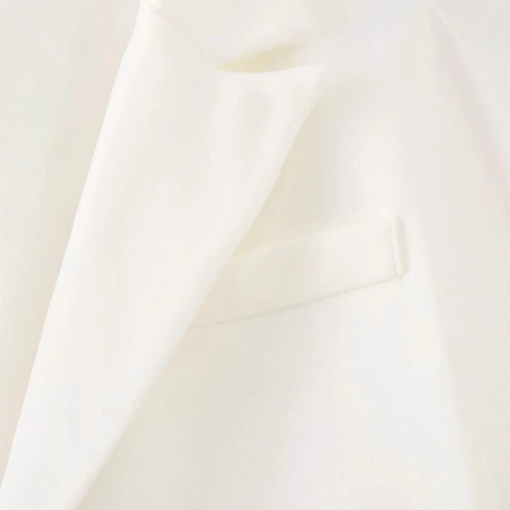 Damen langer Fransen‑Mantelblazer mit Plissee‑Saum, Reverskragen und Pattentaschen – Célinea